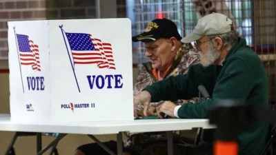 DOJ Tolak Syarat Colorado, Monitor Federal Tetap 100 Kaki dari Sites Pemungutan Suara Adams County